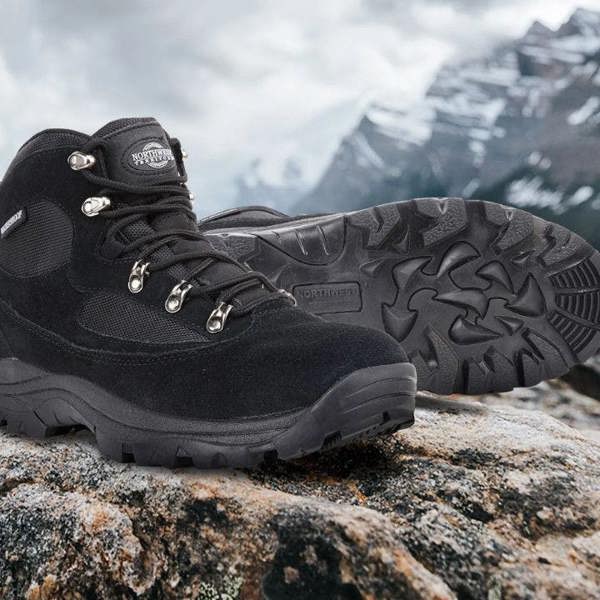Northwest Territory Kendall waterproof walking boot on a rugged rocky mountain