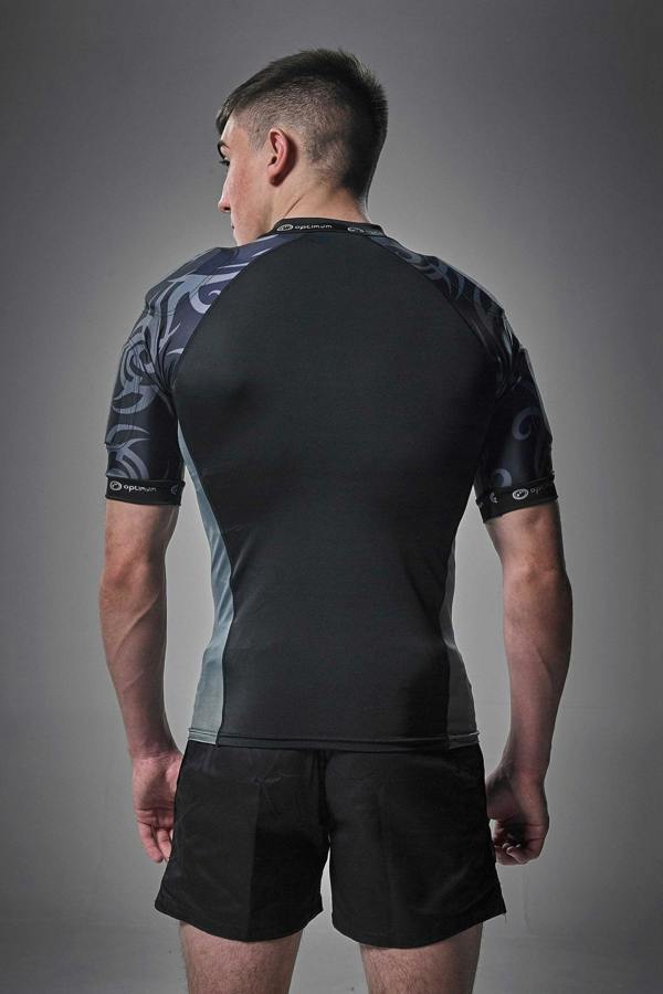 Black Optimum Razor protective top with grey tribal-print padded shoulders, rear view on model - Optimum