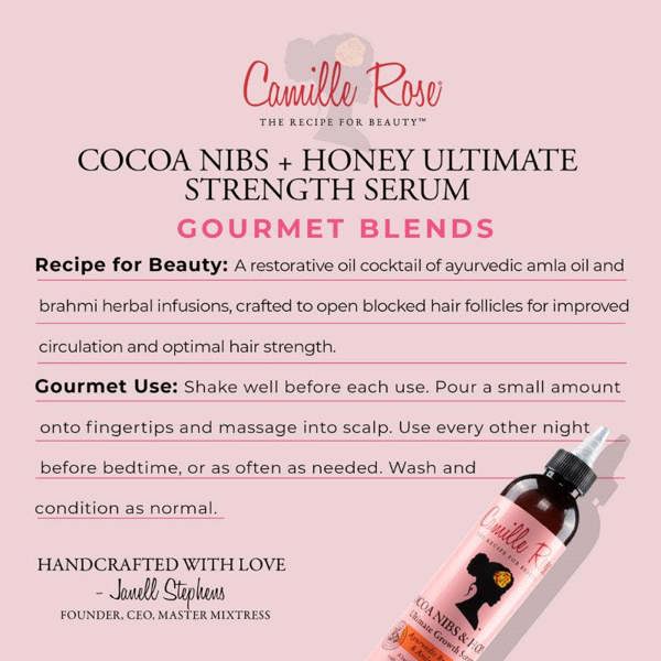 Camille Rose Cocoa Nibs + Honey Ultimate Strength Serum bottle on a pink background with product details.