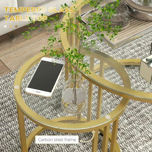 Gold round nesting table with clear tempered glass top and carbon steel frame details