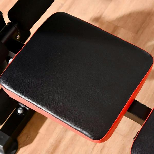 Padded bench seat cushion with black top and red edge trim on metal frame