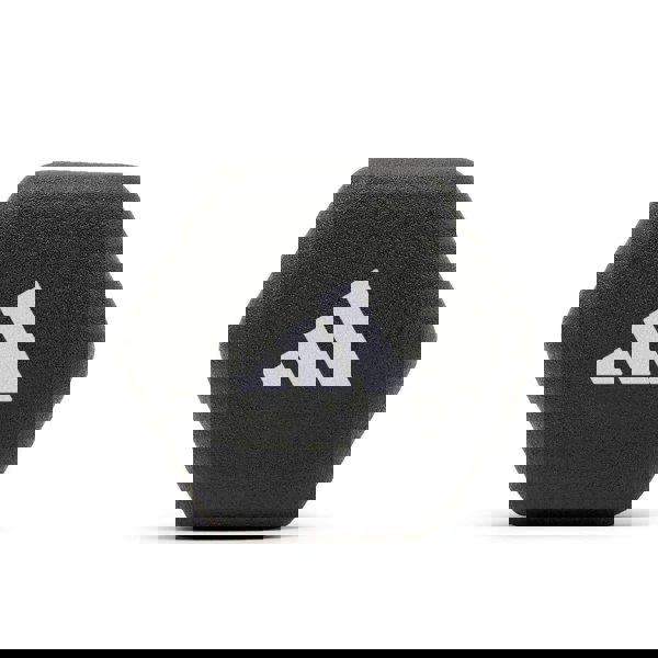 Black hexagonal weight with Adidas logo on a white background