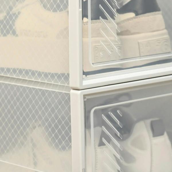 Close-up clear plastic shoe box stack, magnetic door frame and handle