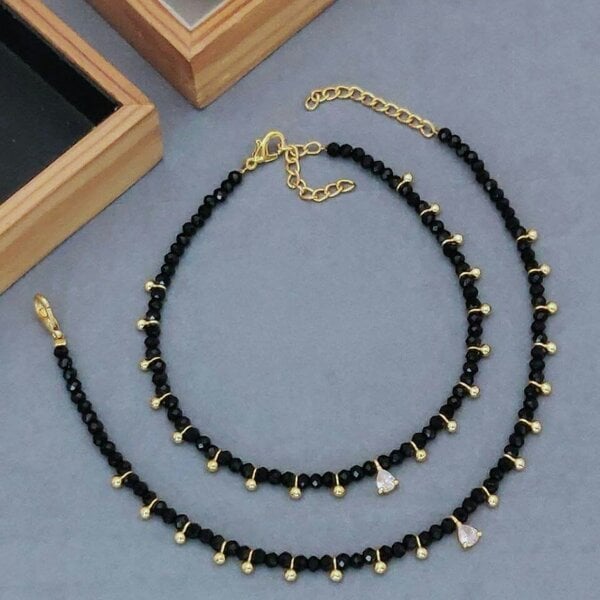 The Colourful Aura Black beaded gold dangle slim nazar payal anklet