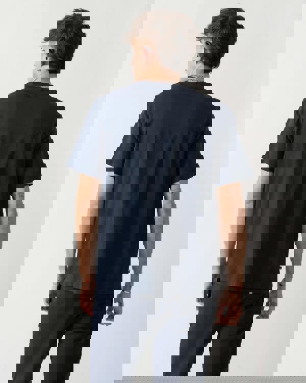 back shot of a model wearing an Aquascutum Mens Badge T-Shirt in Navy 11