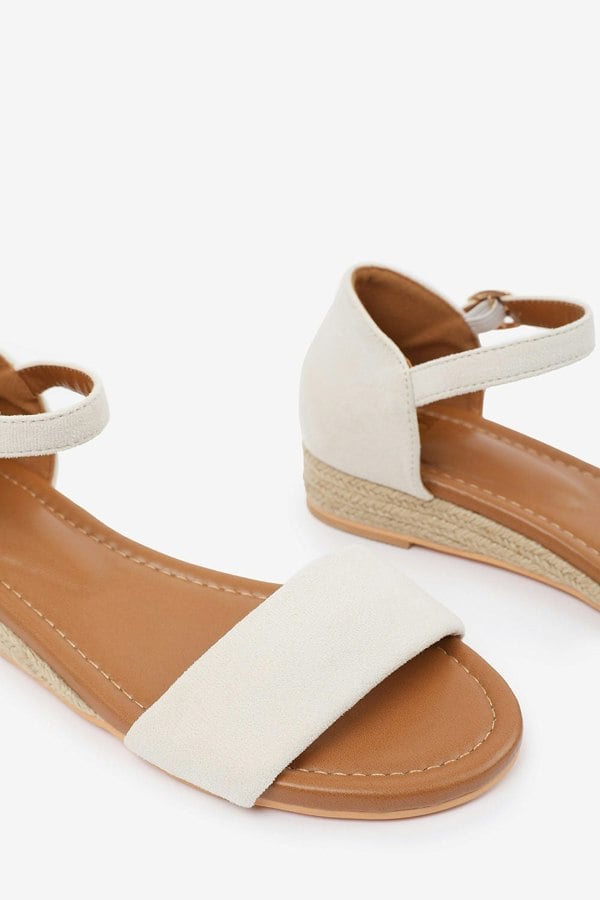 Where's That From Eleanor Wide Fit Low Wedge Shoes With Adjustable Ankle Strap in Cream Suede