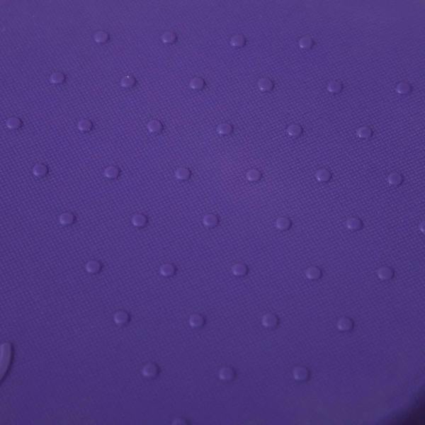 Close-up of a purple stepping stone top with round grip dimples for non-slip play