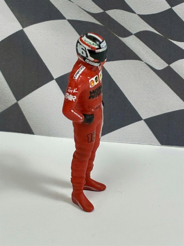 a toy figure of a man wearing a helmet