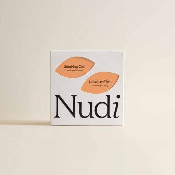 Nuditea Soothing Chai luxury tea box with two orange leaf labels on a white background