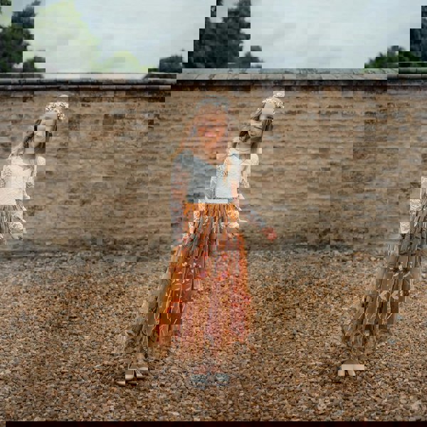 young girl wearing embroidered dress