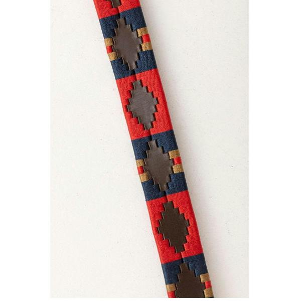 Close-up of the embroidered cotton pattern on the red and navy Rydale Askwith Polo Belt