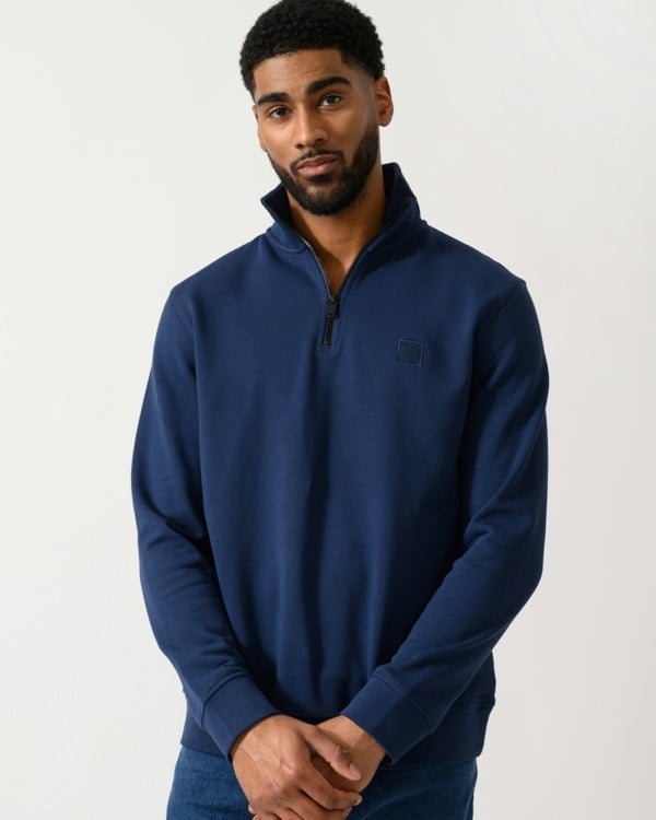 Model wearing a BOSS Orange Zetrust Mens 1/4 Zip Sweatshirt in Open Blue