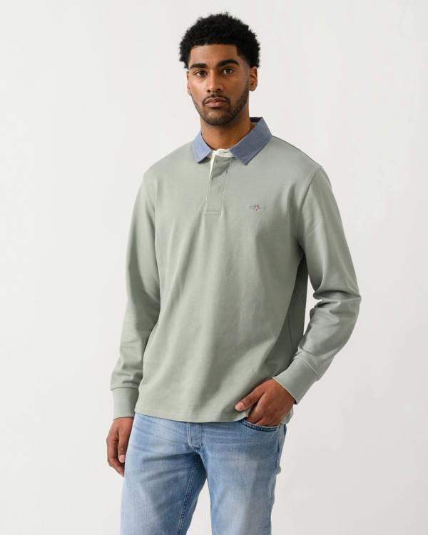model wearing a GANT Mens Regular Chambray Heavy Rugger in 10 Ceramic Grey