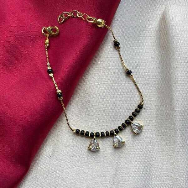 The Colourful Aura Black Bead Mangalsutra Zircon drop gold nazar Bracelet