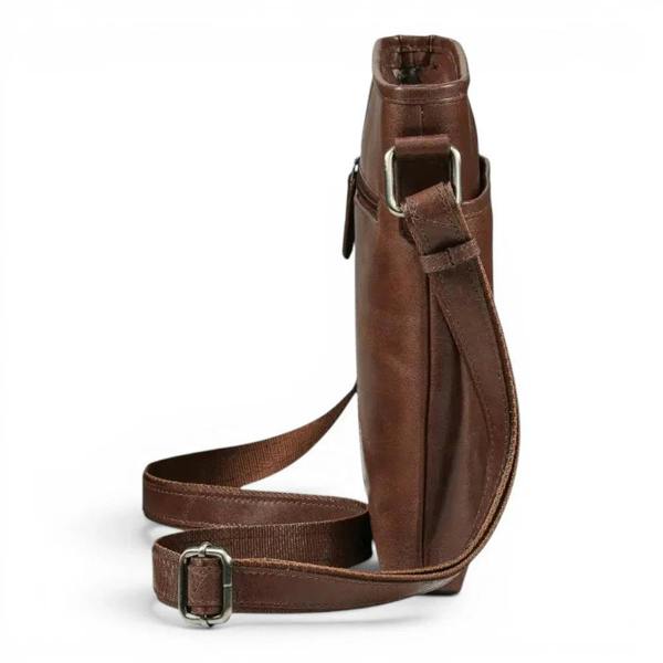 A cognac leather crossbody bag with a matching adjustable strap and silver-tone metal hardware, shown on a plain white background.