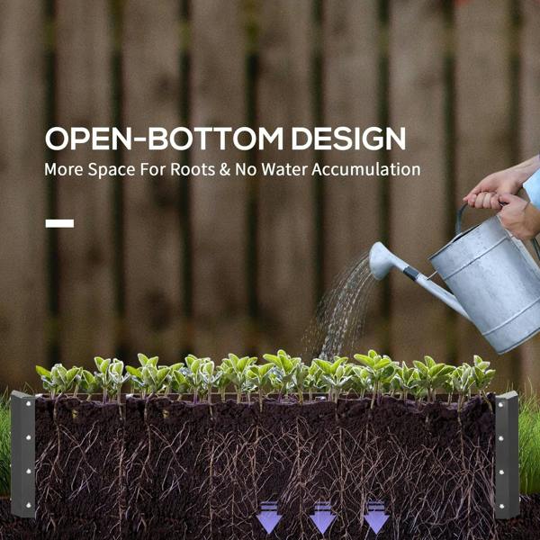 Light grey raised garden bed holding dark soil with hand watering at open top