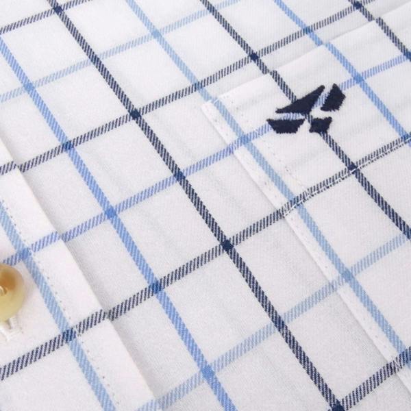 Close-up of Hoggs of Fife Viscount shirt fabric showing wine and green Tattersall check with fine stitching and soft cotton texture