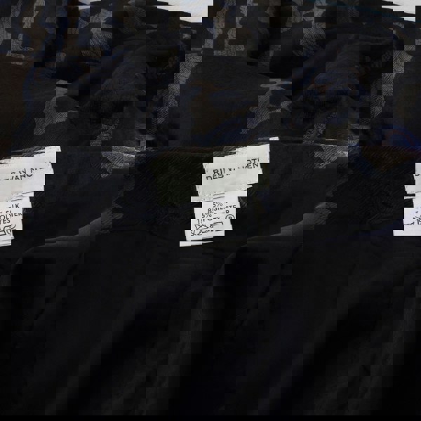 Dries Van Noten swirling jacquard patterned skirt with cape detailing