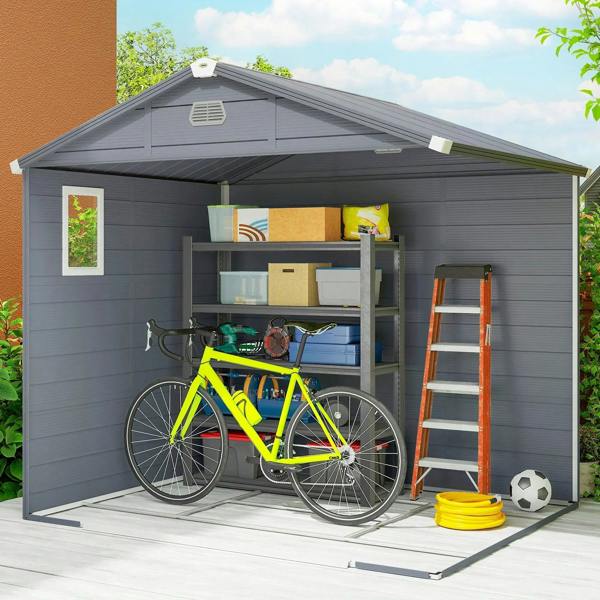 Grey wall shed interior with bicycle, shelves, and garden tools for storage