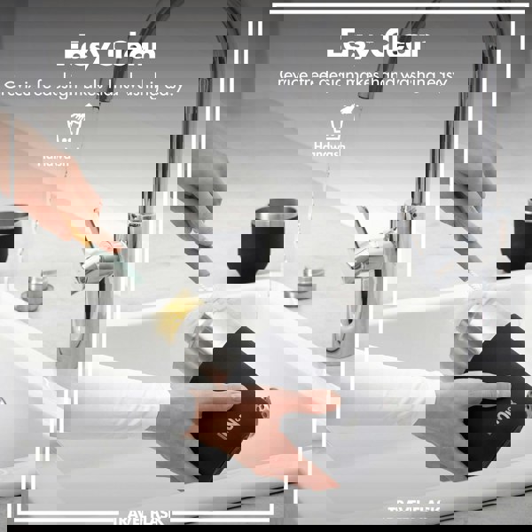 A hand scrubs a black travel flask with a brush under a running faucet in a kitchen sink. Text: Easy Clean Crevice free design makes hand washing easy. Handwash TRAVEL FLASK.