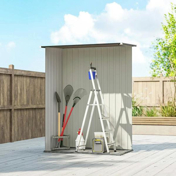 Light gray metal garden storage shed with sloped roof and front single door