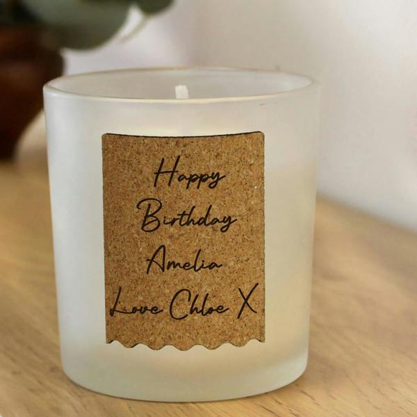 Frosted glass candle with a personalised cork label for Amelia’s birthday.
