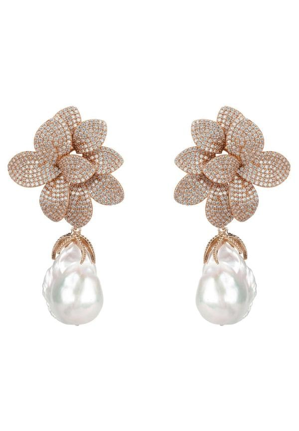 Rose gold flower-shaped earrings with pearl drops on a white background