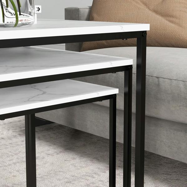 Underside view of nested tables showing black metal supports and white tops