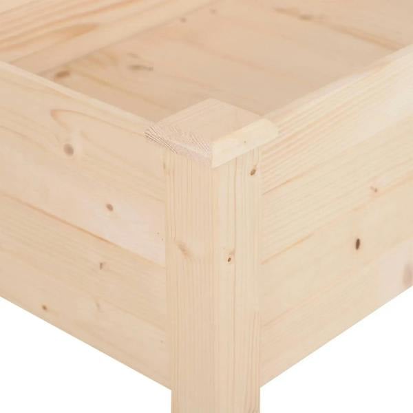 Wooden raised planter corner joint close-up with light pine frame and sturdy corner post