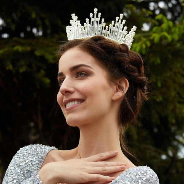 silver crown with pearls worn with braid updo