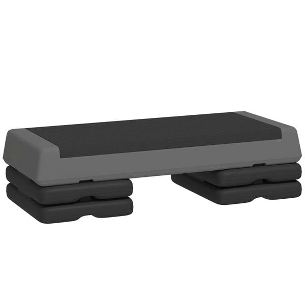 Adjustable grey fitness stepper with wide non-slip top and stacked base