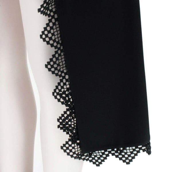 Alexander McQueen black lace trimmed shorts with draped side