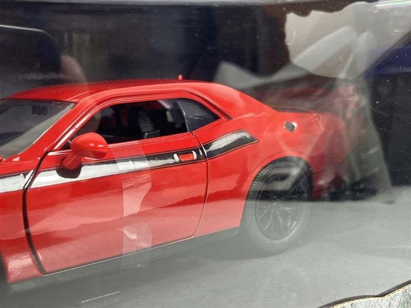 a red car in a glass case