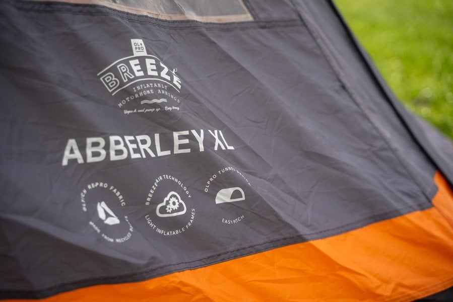 A closeup of the Abberley Xl Breeze® 4 Berth Inflatable Tent from OLPRO logo.