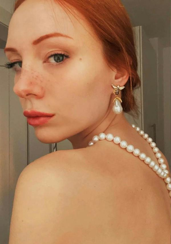 The earring worn by a model.