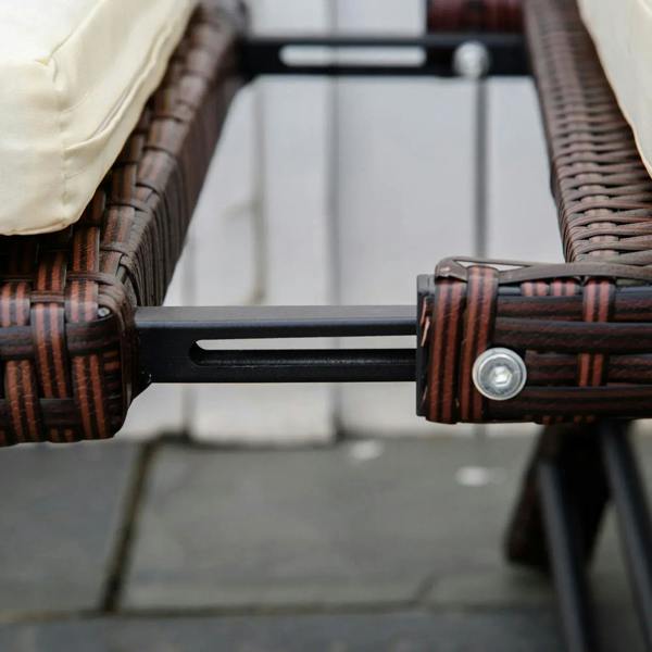 Brown rattan sofa frame with cream cushion corner and metal leg connector bolt
