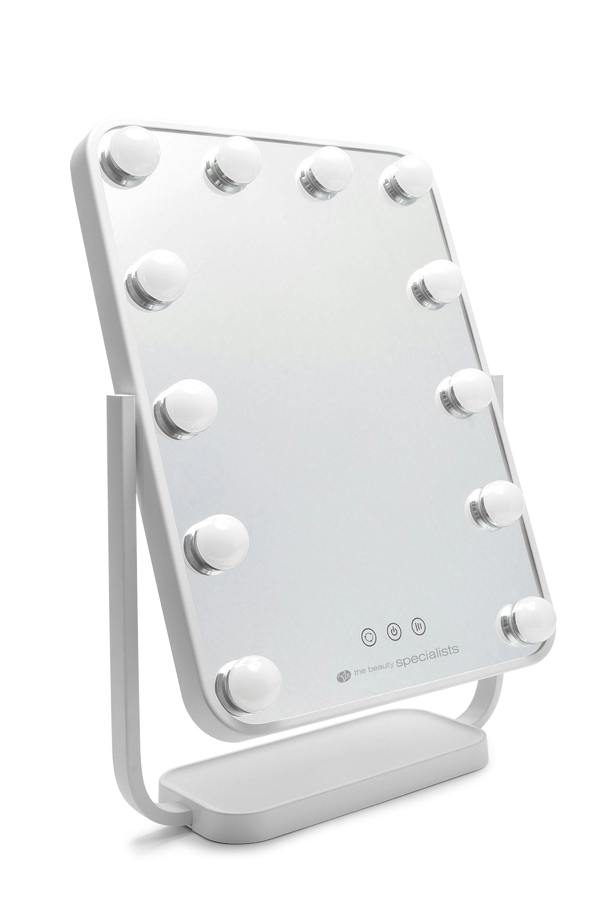 angled view of hollywood glamour dressing table mirror with mirror tilted back
