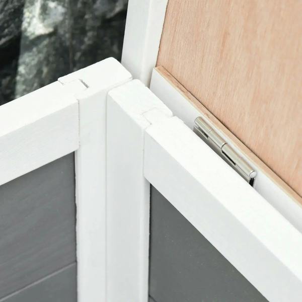 Roof opening hinge and latch detail on white small animal hutch
