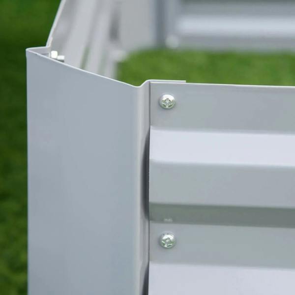 Grey metal planter bed corner joint with two fastening screws