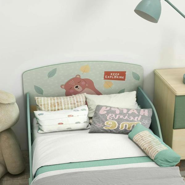 Green toddler bed frame with bear-themed headboard panel and slatted mattress base