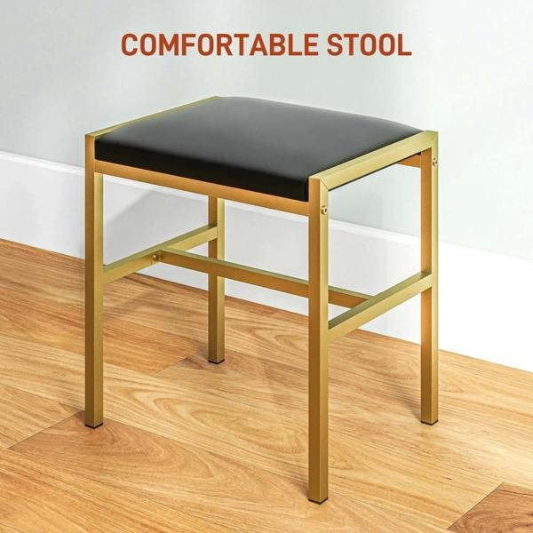 Black cushioned stool with gold frame, designed to pair with a black dressing table