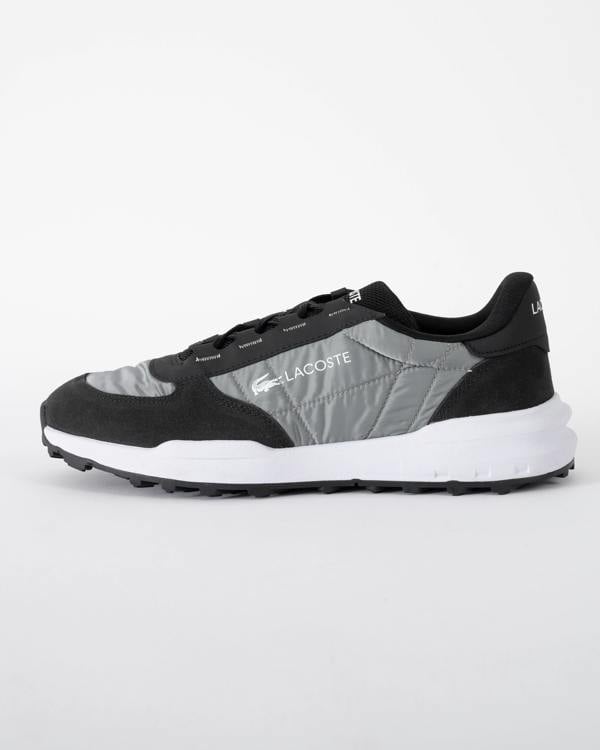 side of Lacoste Elite Active Evo Mens Trainers in Black and White