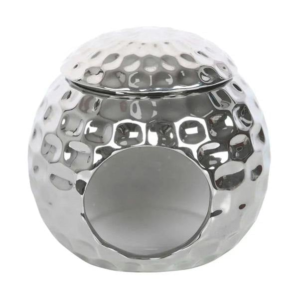 Silver oil burner with wide circular opening on mirrored disco ball dome