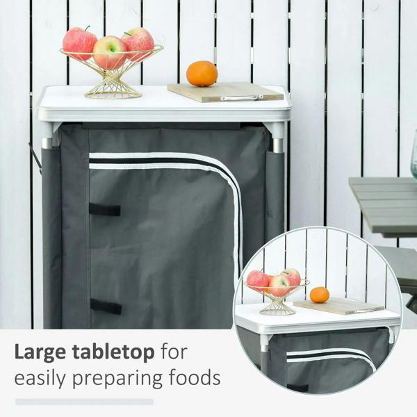 Grey camping kitchen cupboard with countertop and open front storage door, 2 shelves.