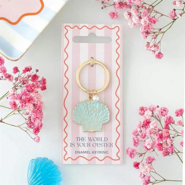 Gold-tone keyring with blue enamel seashell charm and pearl drop
