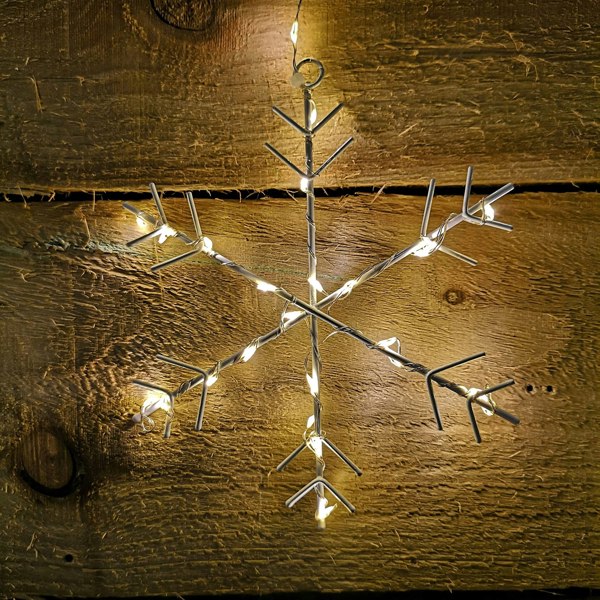 Samuel Alexander 1.2m x 1.2m Christmas Static Snowflake LED Silver Pin Wire V Curtain Lights in Warm White
