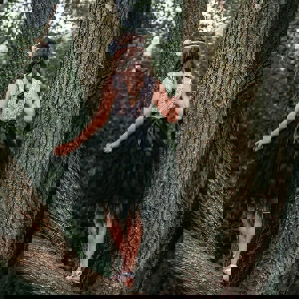 Flower girl dress skirt being held