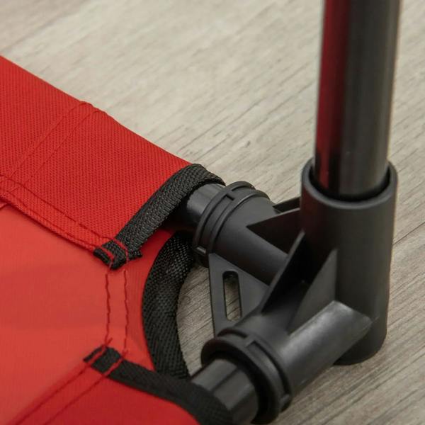 Corner of red elevated dog bed with black straps and protective metal leg