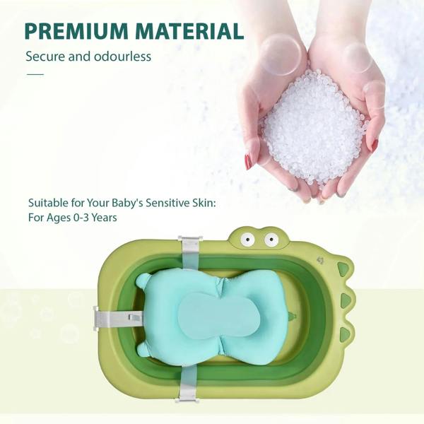 Green baby bath tub with blue cushion and securing straps, open view
