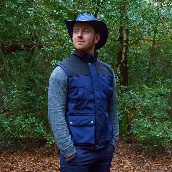 man wearing a wombat navy soft shell outdoor gilet